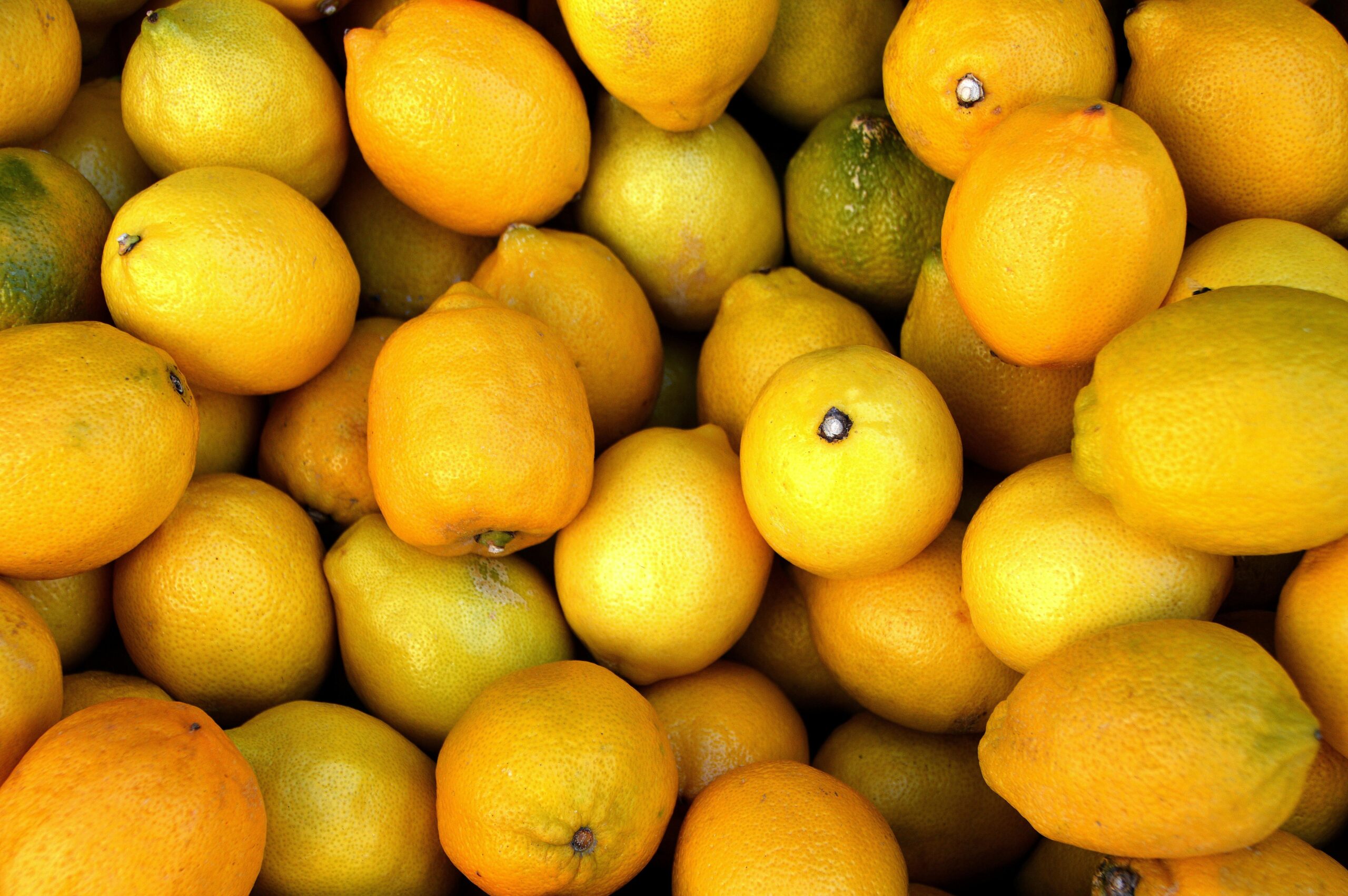 A vibrant close-up of fresh, juicy lemons perfect for healthy diets and vitamin C boost.